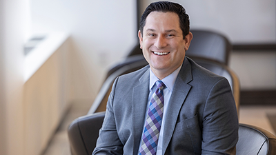 Jason Weingarten smiling in environmental shoot